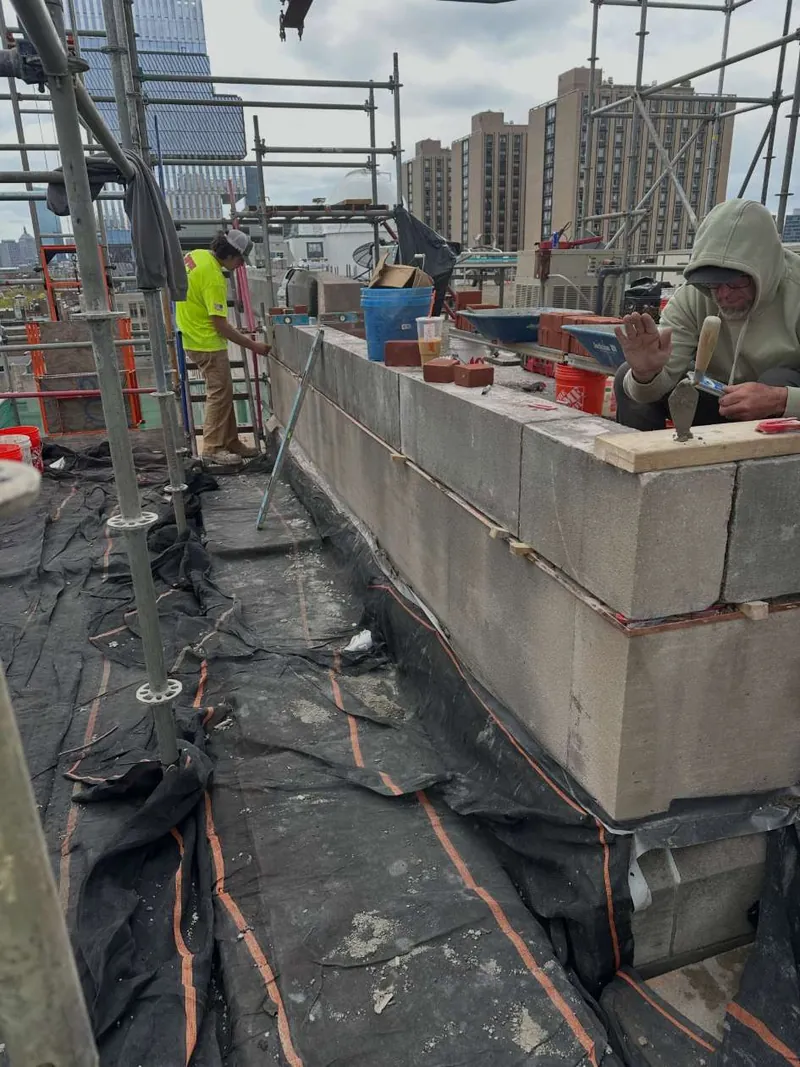 New backup masonry for the parapet rebuild