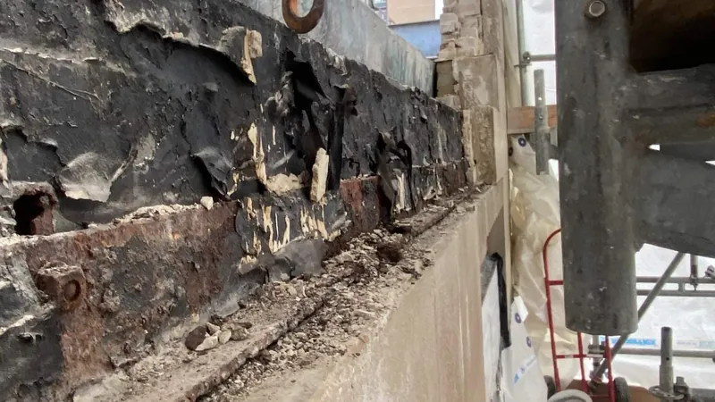 Corroded steel lintel exposed