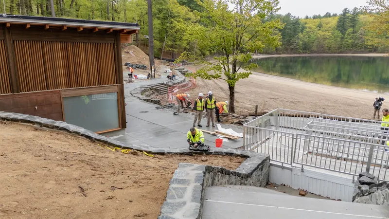 The beach and bathhouse area at Walden Pond during construction