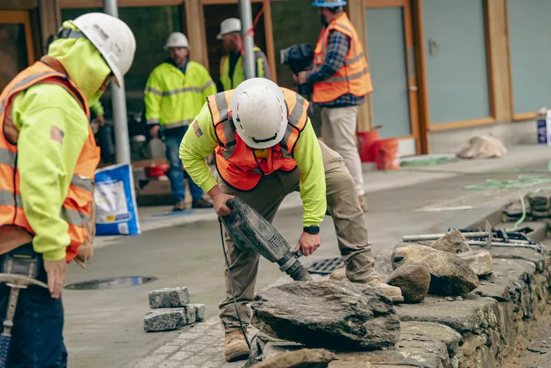 Resetting capstones on the fieldstone wall