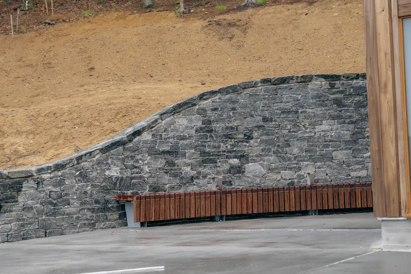 Curved stone wall built by Empire at Walden Pond