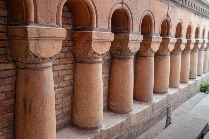Terra cotta colonnettes at the upper story